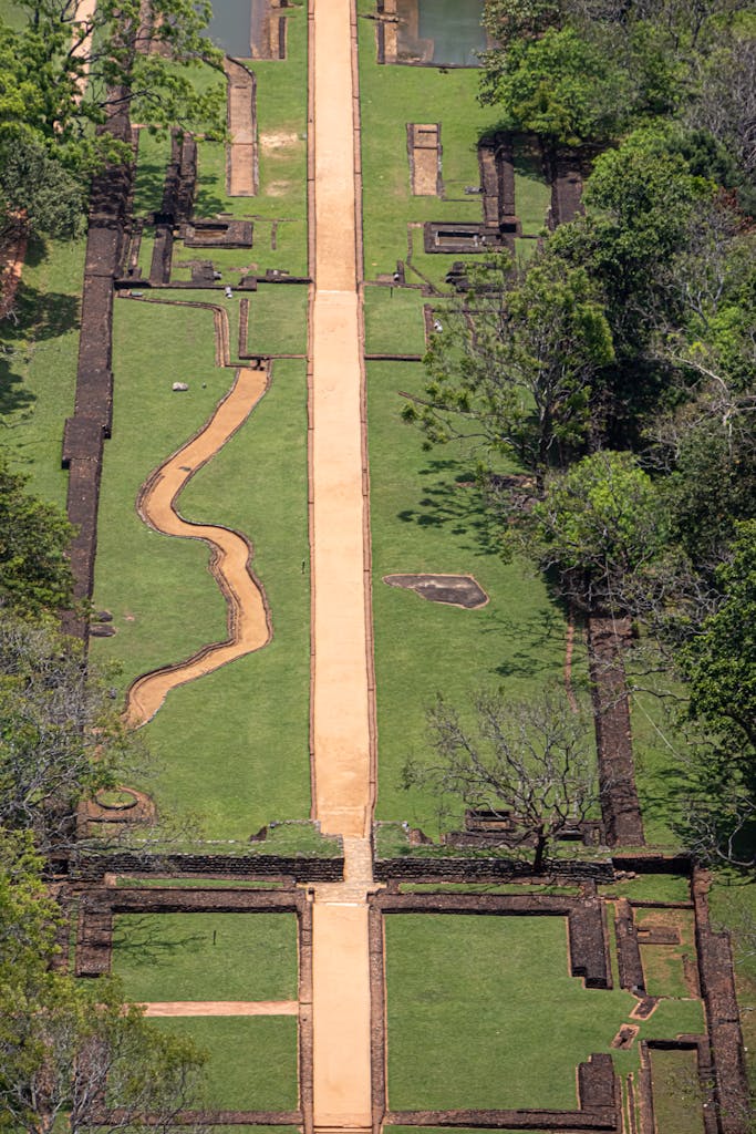 Discover the breathtaking aerial view of Sigiriya, showcasing ancient architecture and lush landscapes.